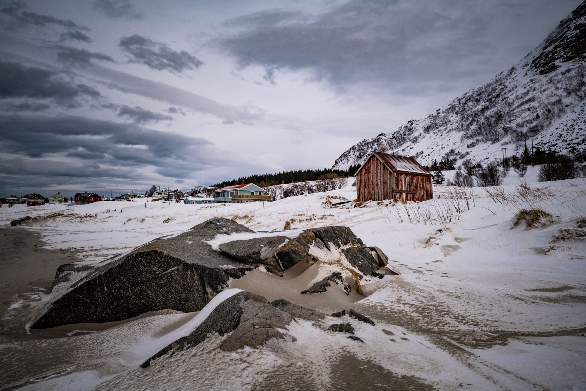 Nordic fjord shoreline with wooden shelter
